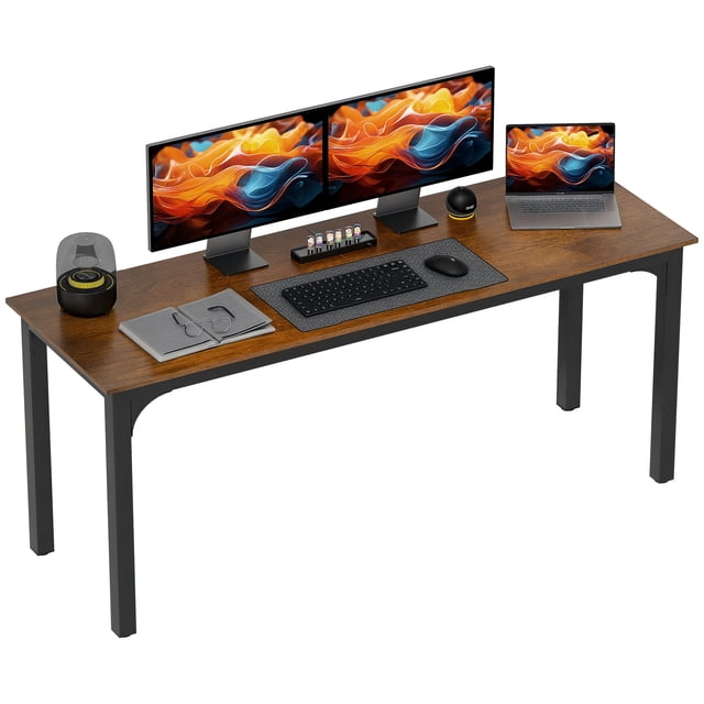 HOMCOM 71" Computer Desk with a rustic brown particleboard surface and black metal legs. The desk is shown supporting dual monitors, a laptop, a keyboard, and other office accessories. Its industrial design features a spacious 70.9-inch length and adjustable foot pads for stability on uneven floors, making it suitable for home offices, dining, or small conference spaces.