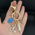 thumbnail image 4 of Nouveau Porte-Clés Médecin Outil Médical Anneau de Clé Seringue d'Injection Stéthoscope Casquette d'Infirmière Porte-Clés Cadeau Médical Bricolage Bijoux Fait Main, 4 of 5