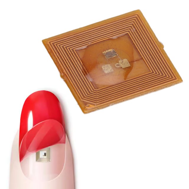 Smart Nail Chip by Ymiko, crafted from durable ABS material with RF frequency of 13.56 MHz. The image highlights the chip next to a red manicured nail, showcasing its adhesive fit for a seamless manicure. Ideal for preset notifications, virtual call scheduling, and efficient data sharing, this smart accessory enhances nail care innovation.