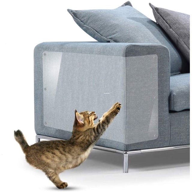 LAICAIW Cat Scratch Furniture Protector 6Pack X Large applied to a modern upholstered couch. Transparent vinyl sheets secured with twist pins provide invisible protection against cat scratches. A cat is seen attempting to scratch the protected area, showcasing the effectiveness of this cat training tape and furniture scratch guard.