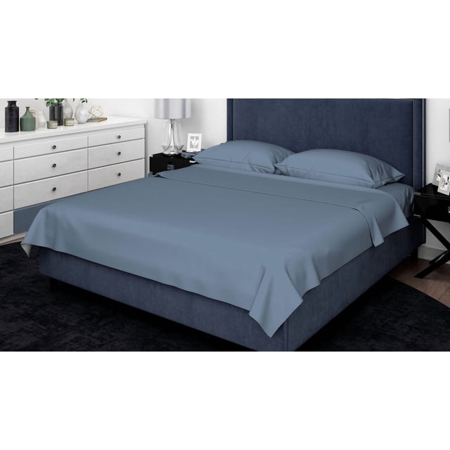 Johnson Home 200 TC Bed Sheet Set - 100% Cotton Sheets in muted blue neatly spread on a bed with a dark blue upholstered headboard with silver nailhead trim, including matching pillowcases, set in a modern bedroom with white dresser and black nightstands, featuring breathable cotton fabric suitable for all seasons.