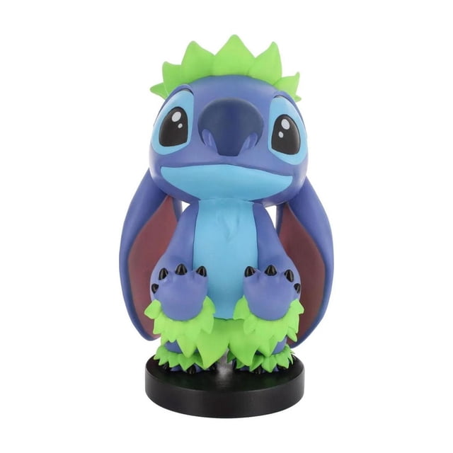 Exquisite Gaming Lilo & Stitch: Hula Stitch Cable Guy Original Controller and Phone Holder showing a front-facing blue and purple Stitch figure with large black eyes, green leaf-like hula skirt and wristbands, on a black circular base, compatible with PlayStation, Xbox, Switch, and retro controllers, and most mobile phones, often used as a decorative desk accessory.