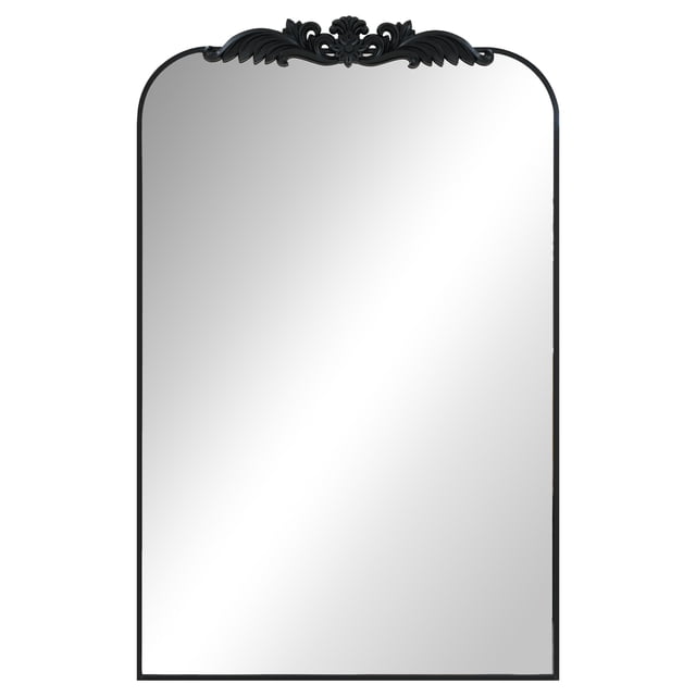 24x38.6 inch metal decor mirror with a sleek black metal frame and ornate decorative crest at the top, rectangular with rounded upper corners, designed for vertical wall mounting in bedrooms, hallways, or entryways, suitable for modern or industrial styles.