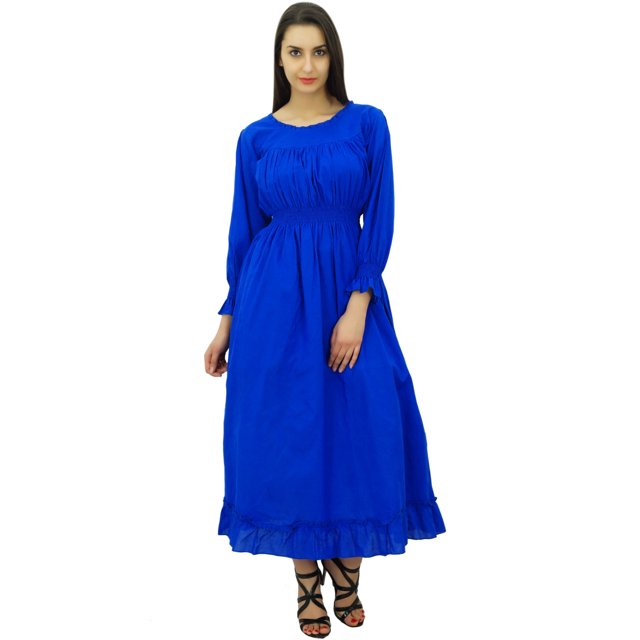 Bimba Robe Longue Décontractée pour Femme en Coton à Taille Smockée, Couleur Bleu Vif. la Robe Présente une Taille Smockée pour une Coupe Flatteuse, des Manches Longues avec Ourlets Élastiques et un Ourlet à Volants. Fabriquée en Tissu de Coton Respirant, Elle Mesure 52 Pouces de Longueur avec des Manches de 21 Pouces. le Modèle Mesure 175 cm de Hauteur et Porte la Robe avec des Sandales Noires à Brides. Convient aux occasions Décontractées, la Robe Offre des options de Personnalisation pour la Longueur et la Taille.
