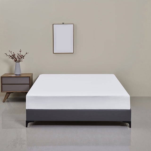 TopLLC Mattress Protector Twin Size, a solid white waterproof elastic fitted mattress pad cover with deep pocket, displayed on a bed in a minimalist bedroom setting. Made of soft, breathable, skin-friendly polyester, it measures 39x75 inches and fits mattresses up to 14 inches thick. Designed for easy care, it is machine washable and quick-drying.