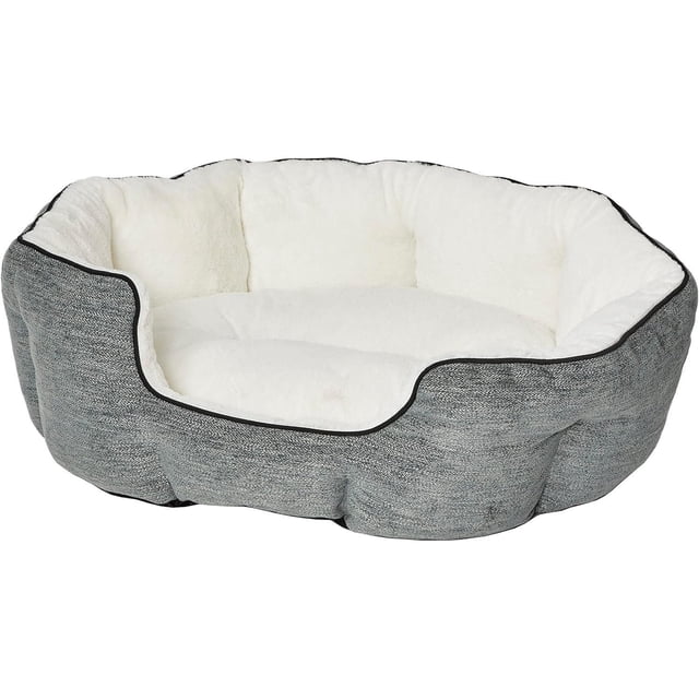 MidWest QuietTime Deluxe Grey Medium Bed with high bolsters and a low front entry, featuring textured grey fabric exterior and plush white interior cushion. Designed for cats and small dogs, it provides warmth, security, and a no-slip base for indoor stability.