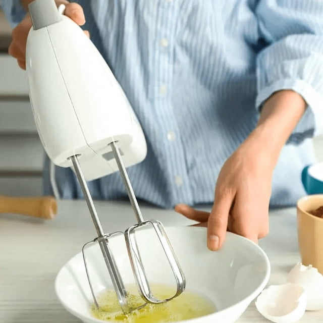 2Pcs Hand Mixer Beaters Blender Attachments, replacement attachments compatible with Hamilton Beach electric hand mixers, shown whisking eggs in a white bowl. Made of stainless steel with a traditional beater design for handheld mixers, suitable for mixing batters, whipping cream, and other baking tasks.
