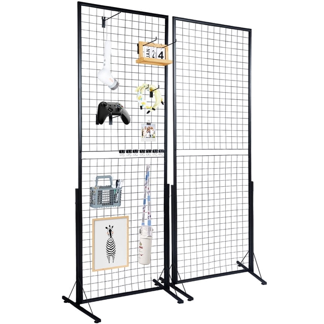 KFFKFF 2ft x 5.6ft Grid Wall Panel Tower, dual pack wire display racks with T-base stand. Two-sided gridwall panels made of durable 1022A steel, shown in a black finish. Includes additional hooks, clips, and accessories for versatile use in art exhibitions, retail showcasing, or home organization. The panels are displayed with various items such as a framed picture, a gaming controller, and a calendar, demonstrating their functionality. Ideal as a grid display rack or vertical storage solution, the foldable design and sturdy T-shaped legs provide stability and portability.