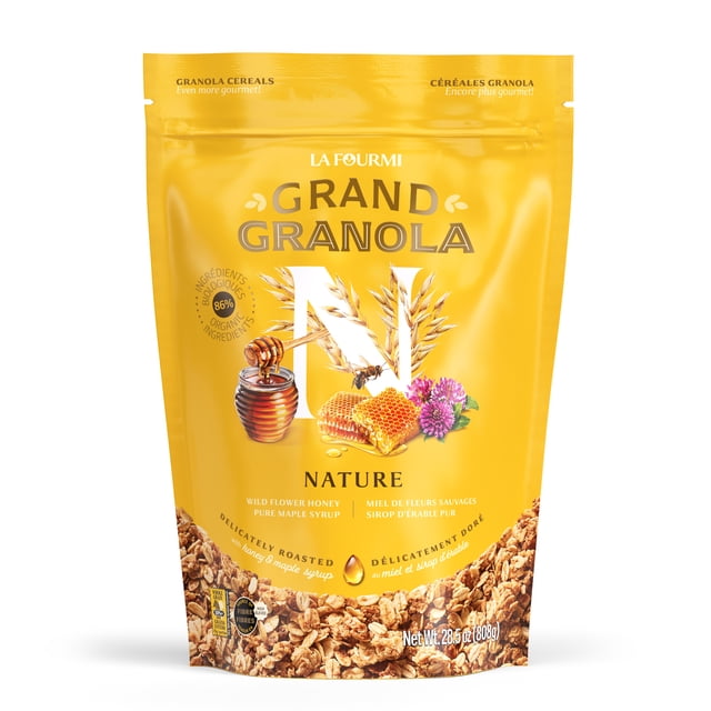 Grand Granola Nature (808g) by La Fourmi in a resealable yellow pouch featuring a vibrant design with honeycomb, wildflower, and oat graphics. The granola is delicately roasted with Canadian wildflower honey and organic maple syrup, offering sweet and salty caramelized notes. Certified organic, kosher, non-GMO, and whole grain, it contains 83% locally sourced ingredients, 6g of sugar, 5g of protein, and is high in fibre per serving. Ideal for breakfast with milk or yogurt, as a topping, or as a snack.