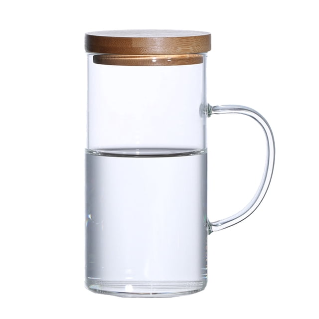 Glass Water Pitcher With Lid Handle Juice Jug for Cold Beverages. Transparent glass jug with a wooden lid and an easy-grip handle, designed for serving water, juice, and other beverages. The pitcher has a 400ml capacity and features a durable, elegant design suitable for kitchen use or entertaining.