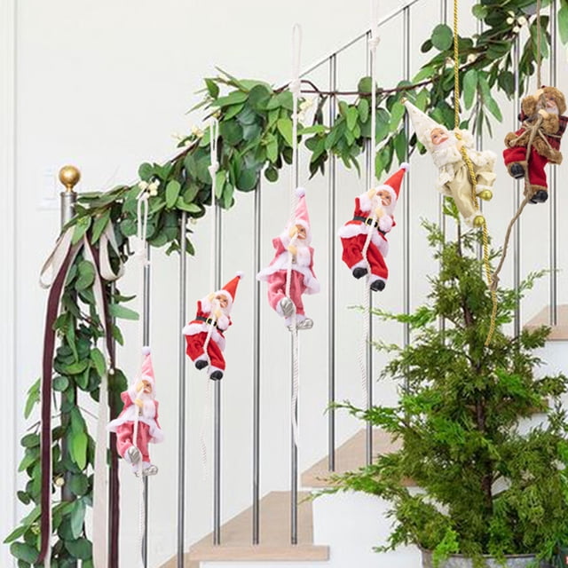 REK Novelty Climbing Santa Design: This Christmas Tree Ornament Features A Playful Santa Climbing On A Rope Adding A Whimsical And Unique To Your Holiday De Cor. The Funny