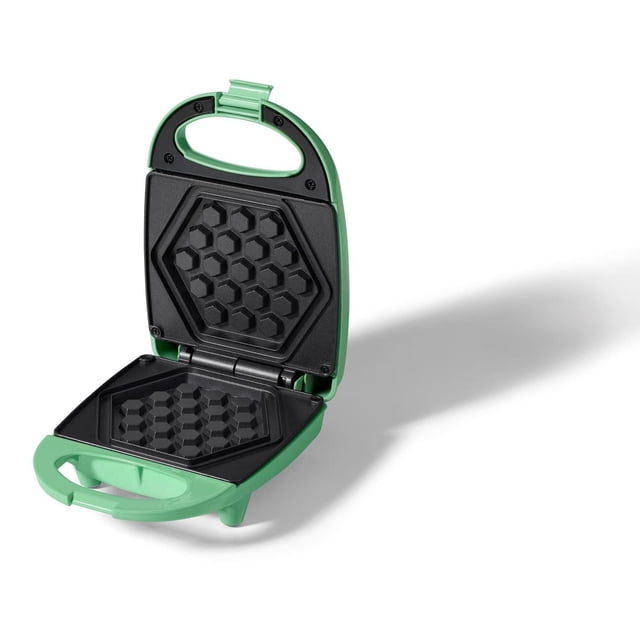 Ricardo Mini Waffle Maker in green with open non-stick honeycomb plates, compact vertical storage, cool-touch handle, and 520W power for quick, uniform waffles, suitable for small kitchens and easy cleaning.