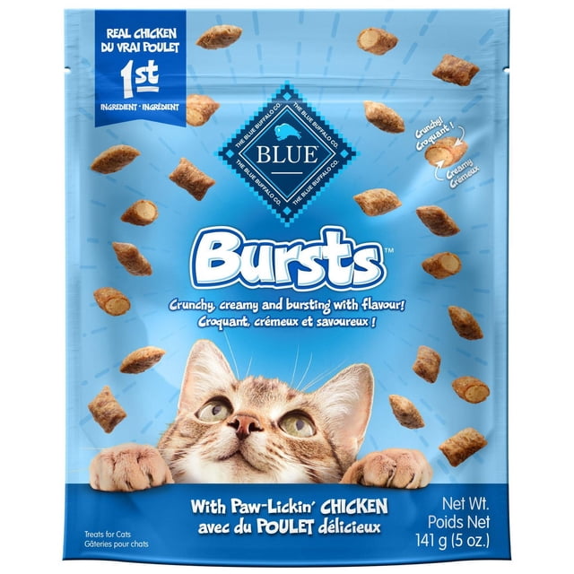 Blue Buffalo Bursts Chicken Flavor Crunchy Treats for Cats in a blue resealable bag featuring a tabby cat peeking over the bottom edge, surrounded by crunchy treats with a crunchy shell and creamy chicken center, highlighting real chicken as the first ingredient and a net weight of 141 g (5 oz).