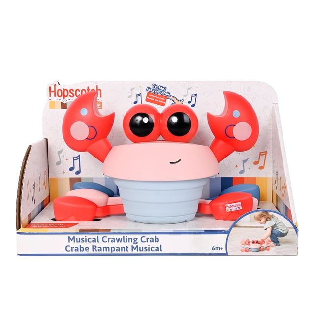 Hopscotch Lane Dancing Crab toddler musical crawling toy with red-and-white stylized crab body, centered front-facing view showing six articulated legs and flat bottom, visible top button and speaker grille, small rear on/off switch; motorized crawling pose on a light neutral floor, designed to encourage crawling and sensory play for babies, often used to prompt movement during tummy time.