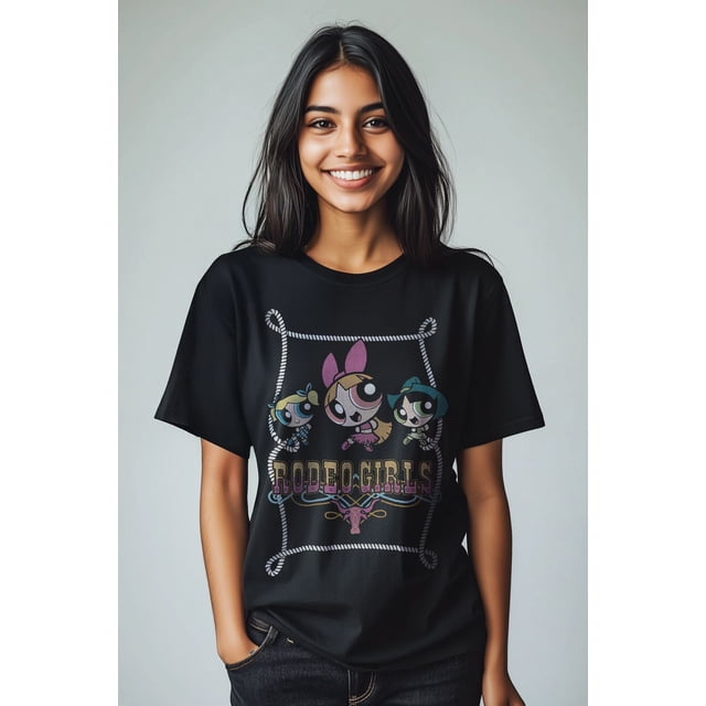 Powerpuff Girls Rodeo Girls T-Shirt in black featuring Blossom, Bubbles, and Buttercup inside a rope frame with 'RODEO GIRLS' lettering and a steer skull graphic, made of comfortable fabric and styled with dark jeans.