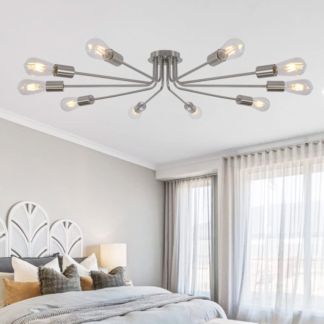 TULUCE 10 Light Sputnik Chandelier in brushed nickel finish, a modern flush mount ceiling light with 10 radiating arms and exposed bulb sockets. Ideal for kitchens, dining rooms, living rooms, or foyers. Shown installed in a contemporary bedroom with neutral decor. Bulbs not included.
