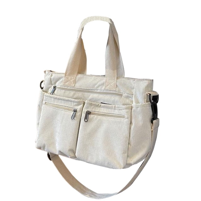 Destyer Simple Women's Shoulder Bag with Front Zipper Pocket in white, made of durable corduroy fabric. Features a large capacity suitable for a 14-inch laptop and daily essentials, multiple pockets for organization, and a foldable, portable design. Includes dual handles and an adjustable shoulder strap for versatile carrying options.