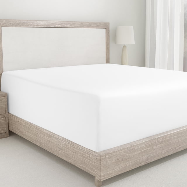 California Design Den Double Fitted Sheet Only in bright white, made from 100% cotton sateen with a 400 thread count. This deep pocket fitted sheet fits mattresses 8 to 16 inches deep and features all-around elastic for a snug fit. The sheet includes head and foot indicators for easy bed-making and is breathable, cooling, and OEKO-TEX certified. Shown on a bed in a minimalist bedroom with light wood furniture and neutral decor.