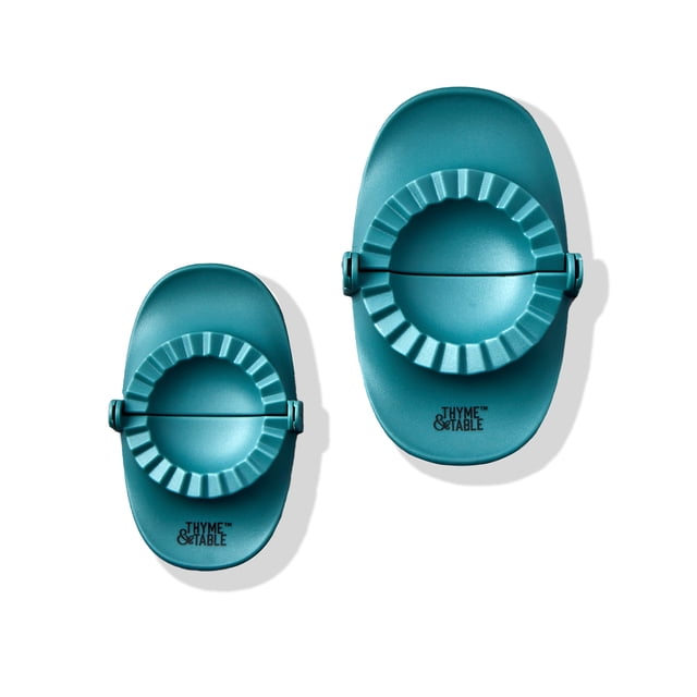 Thyme and Table 2pc Dumpling Press set in muted blue, featuring two oval plastic presses with ridged circular molds and hinged handles for shaping dumplings and stuffed treats, displayed on a white background.