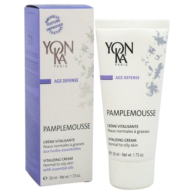 Yonka 1.73 Cream For Unisex, a face moisturizer designed for normal to oily skin, shown with its packaging. The cream is labeled as 'Pamplemousse Vitalizing Cream' with essential oils and is part of the Yon-Ka Age Defense line. The packaging features a white and purple design with floral accents, and the tube contains 50 ml (1.73 oz) of product.
