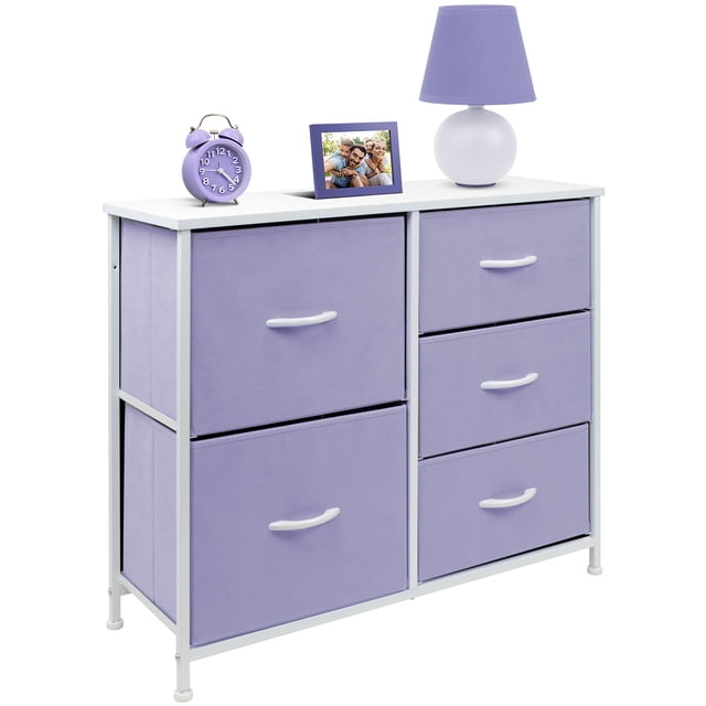 5 Drawers Chest Dresser - Purple by Sorbus, featuring a white MDF wood top and a strong steel frame. The dresser includes five spacious, pastel purple fabric drawers with white handles, ideal for storing kids' clothes, toys, and household items. The top surface is styled with a purple lamp, a photo frame, and a purple alarm clock, showcasing its display functionality. Measures approximately 25” L x 11.87” W x 28.75” H.