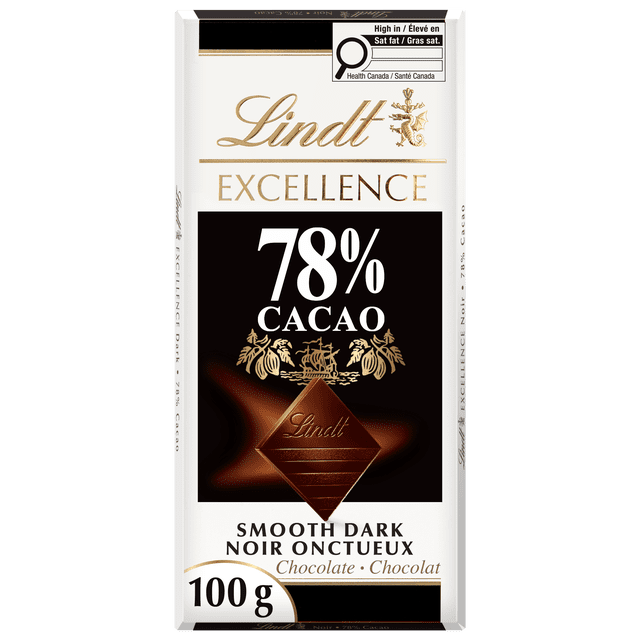 Lindt EXCELLENCE 78% Cacao Dark Chocolate Bar, 100g, with white packaging featuring gold and black text, a central embossed dark chocolate square, and a Health Canada saturated fat warning. This smooth Swiss dark chocolate is suitable for pairing with coffee, tea, or red wine.