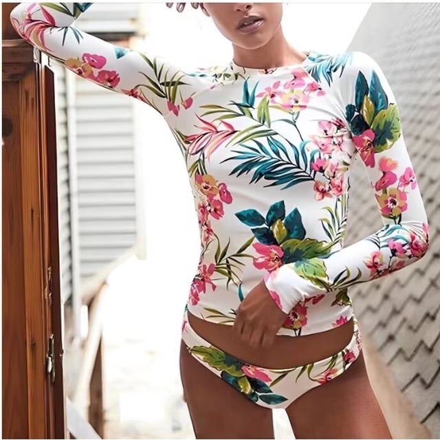 Women's Floral Printed Two Piece Swimsuit with a long sleeve rash guard top and bikini bottoms. This women's swimwear features vibrant floral patterns on a white background, crafted from 82% nylon and 18% spandex for elasticity, quick-drying comfort, and breathability. Designed with UPF 50+ sun protection, this rash guard bikini set is ideal for swimming, surfing, snorkeling, and other water activities.