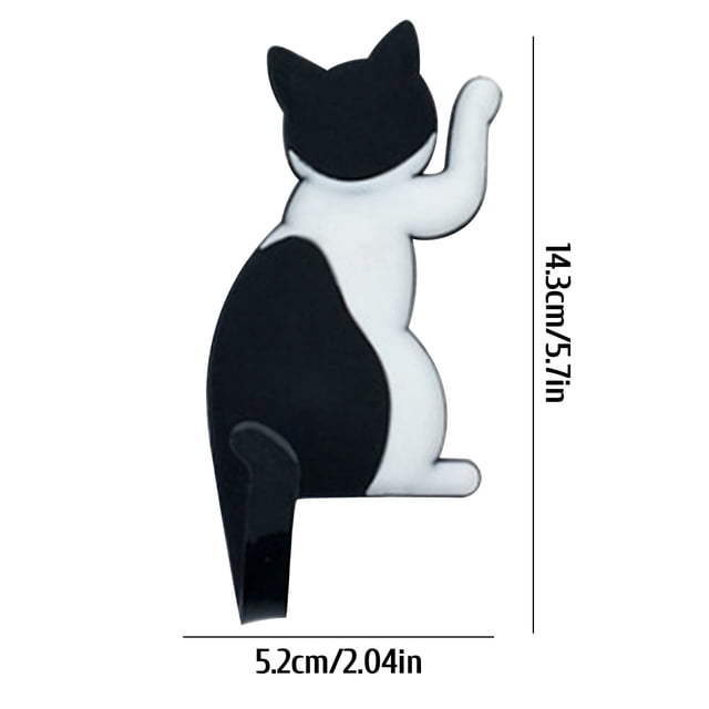 Pompotops Strong Magnetic Hook Japanese Creative Cartoon Cat Tail Refrigerator Stick Hook. A black and white cartoon-style cat-shaped magnetic hook with a flexible tail that doubles as a hook. The hook measures 14.3 cm (5.7 in) in height and 5.2 cm (2.04 in) in width. Designed for use on refrigerators or iron surfaces, it offers efficient sorting and storage while adding a playful touch to kitchens or offices.