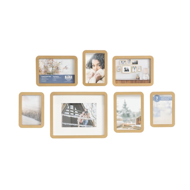 Boba 7pc Gold Gallery Picture Frame Set — centered, front-facing display of seven rounded-rectangle gold photo frames: one 8" x 10" matted to 5" x 7", three 5" x 7" and three 4" x 6"; shows attached easels, wall hangers and photo-hanging template; also suitable for small art prints or pressed botanicals.