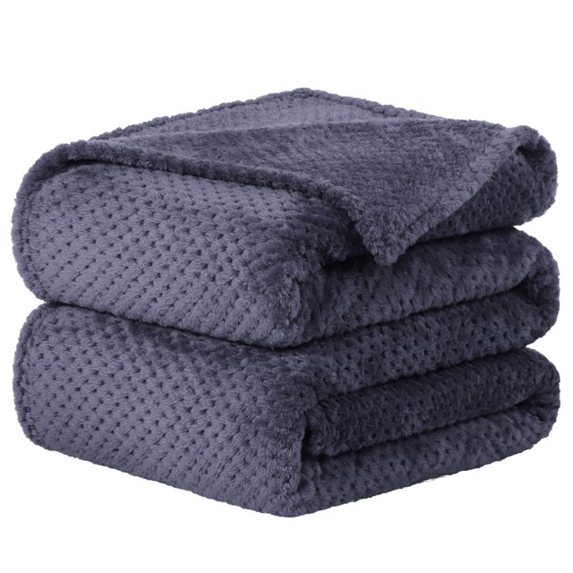 Unique Bargains Luxury Fleece Bed Blanket Woven Mesh in a folded stack, featuring a soft flannel texture with a unique popcorn pattern and woven mesh design. The blanket is a deep slate blue color, made from 100% microfiber polyester with 300GSM thickness for lightweight warmth and breathability. Ideal for use as bedding or a throw blanket, it includes durable stitching to prevent fraying and is machine washable for easy care.