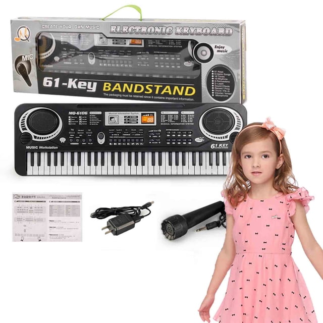 Kids 61 Key Electronic Piano Keyboard Toy with USB microphone, shown with its packaging, power adapter, and microphone. The keyboard features a compact design with built-in speakers, multiple function buttons, and a black and white key layout. Suitable as a portable musical instrument and educational music gift, measuring 54x17x5.5 cm.