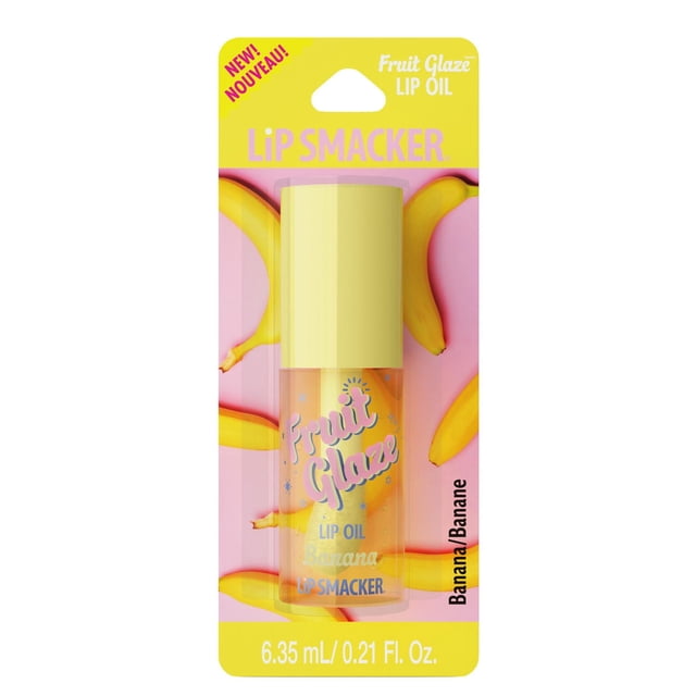 Fruit Glaze Lip Oil by Lip Smacker in banana flavor, a clear lip oil bottle with a yellow cap on a pink card featuring banana graphics, containing 6.35 mL (0.21 fl oz) of hydrating, fruit-flavored lip care.