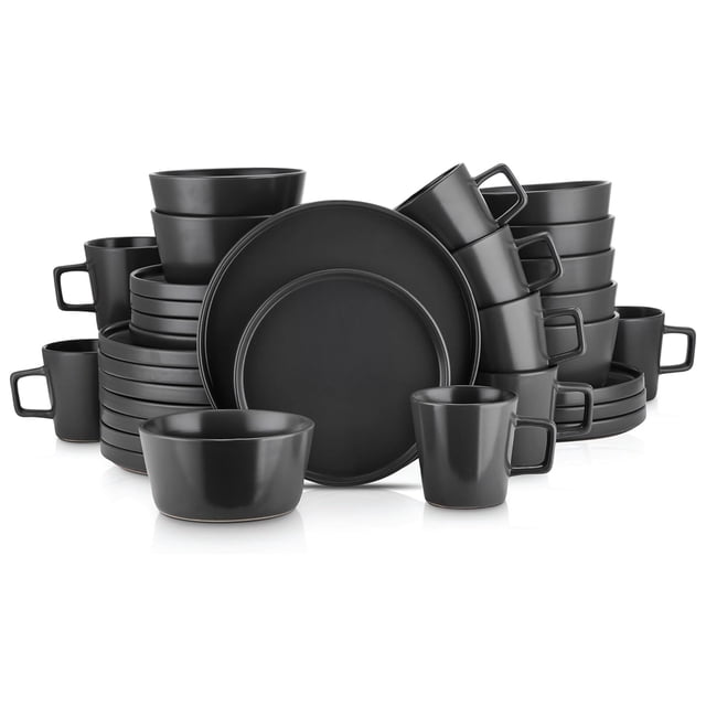 Stone Lain Celina Stoneware 16 Piece Dinnerware Set in black matte finish, featuring a complete service for 4. Includes 4 dinner plates (10.25 inches), 4 salad plates (7.5 inches), 4 deep bowls (5.63 inches), and 4 mugs (12 oz). The set showcases a modern design with sculpted lipped rims and a sleek matte texture. Crafted from durable stoneware, it is microwave and dishwasher safe, ideal for both casual meals and formal dining occasions.