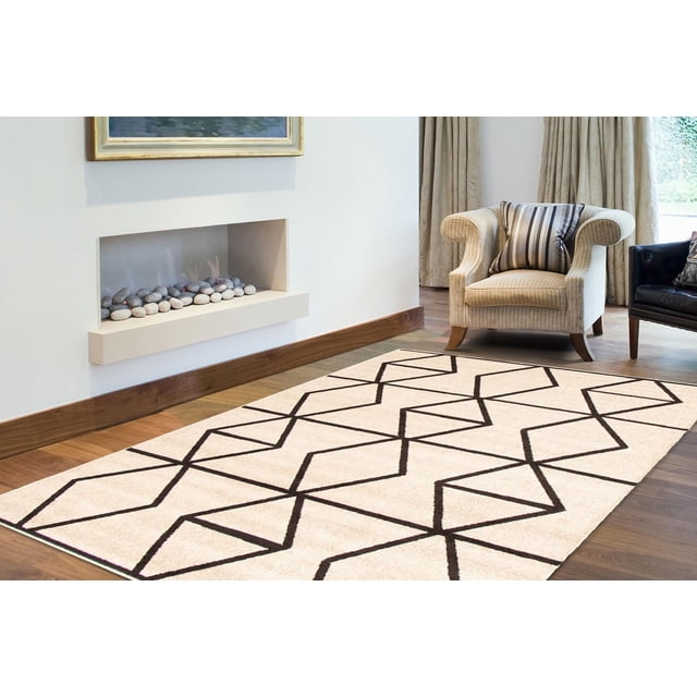 ECARPET Living Room Bedroom Carpet, Geometric Indoor Area Rug Ana Collection with cream base and black zigzag geometric pattern, placed on hardwood flooring in a living room with a beige armchair and built-in modern fireplace, often used as an accent rug to enhance interior texture and style.