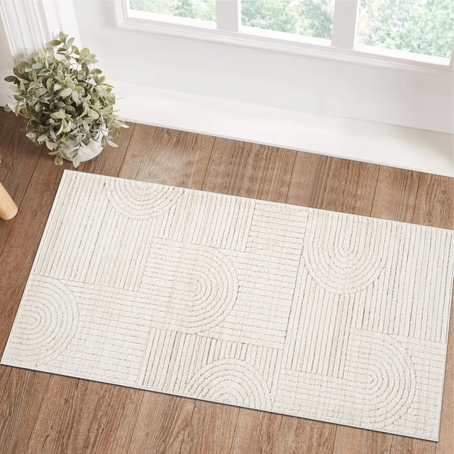 Rug Branch Astra Modern Indoor Area Rug in cream beige with geometric textured half-circle and linear patterns, placed on wood flooring near a window and potted plant, suitable for kitchen mats and rugs with easy-care polyester and jute backing.