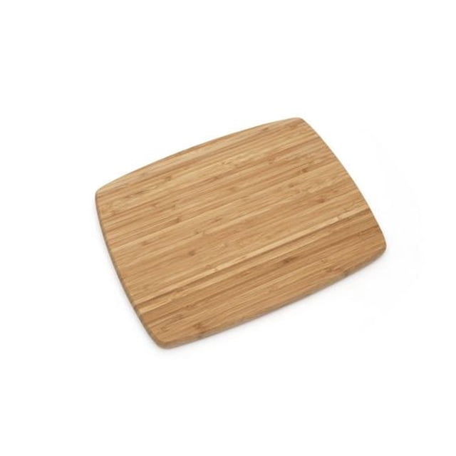 Farberware® Bamboo Cutting Board 11"x14" shown from a slight angle, featuring a rectangular shape with rounded corners and a smooth bamboo surface with natural grain. This durable, moisture-resistant cutting board is ideal for kitchen food preparation and offers an eco-friendly option.