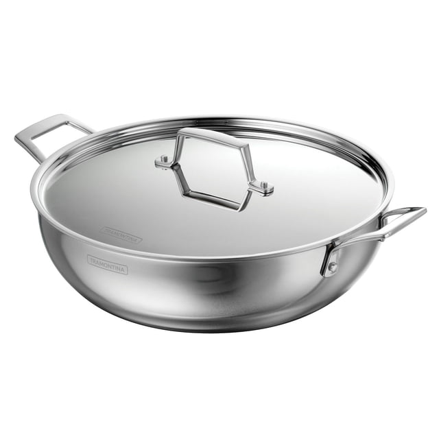 Tramontina Utsava Tri-Ply Clad Stainless Steel Covered Kadai with polished mirror exterior and satin-finish interior, featuring a wide round body, two stainless steel handles, and a matching lid handle. Compatible with all cooktops including induction and oven safe up to 500°F, suitable for cooking family meals and shallow frying.