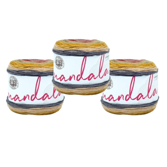 Lion Brand Yarn Mandala Multicolor Light DK Acrylic 3 Pack Yarn showing three skeins in a gradient of mustard yellow, gray, and rust colors, each with a white label featuring red 'Mandala' text and the Lion Brand logo, suitable for crocheting scarves, shawls, or hats.