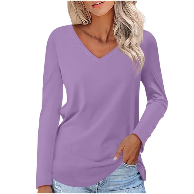 Timegard Womens Tops V-Neck Long Sleeve Basic Tee in a solid lavender color. This casual tunic top features a relaxed fit with clean lines and a simple silhouette, ideal for layering with cardigans or jackets. Made from soft, breathable fabric, it is suitable for spring, summer, and fall. Shown styled with light-wash denim jeans.