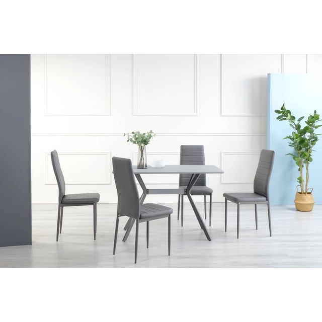 K-Living Nash 5PCS Grey Anti Scratch, Powder Coated Metal Dining Set with PU Chairs featuring a rectangular grey dining table with angled powder-coated metal legs and four matching grey PU upholstered chairs with metal frames, set in a minimalist room with light wood flooring and subtle wall paneling, ideal for compact dining spaces and comfortable seating.