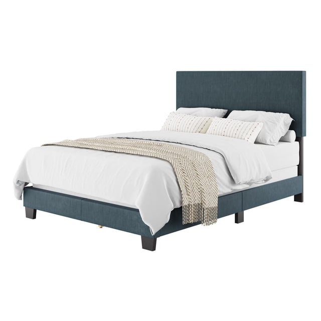 CorLiving Celeste Modern Upholstered Adult Full Sized Bed Frame with Headboard in blue fabric, featuring a padded headboard and dark wooden legs, styled with white bedding and a beige textured throw, designed for a full mattress and box spring, suitable for enhancing bedroom comfort and decor.