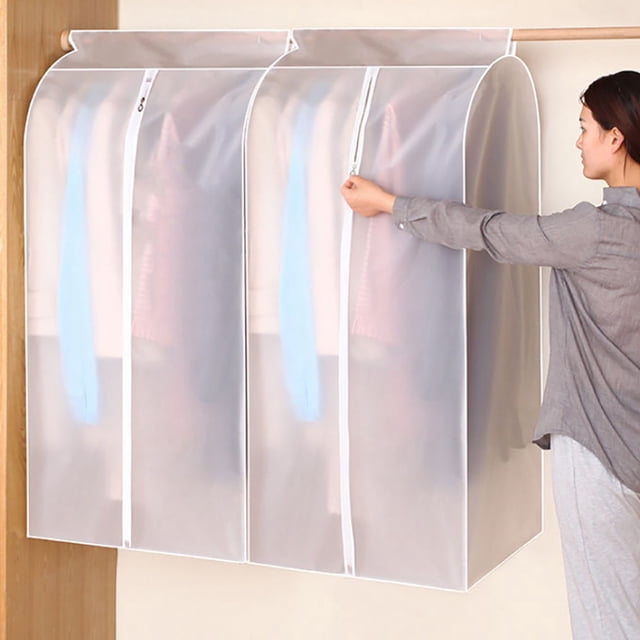 1PCS Clothing Rack Dust Cover Clothes Hanging Bag Enclosed Clothes Rack Floor Hanger Cover Wardrobe Storage Cover B. Semi-transparent white plastic cover with a smooth zipper, designed to protect clothes from dust, moisture, and pests. The cover is shown hanging on a wooden rod, enclosing garments while maintaining visibility of the contents. Dimensions: 60 x 50 x 90 cm.