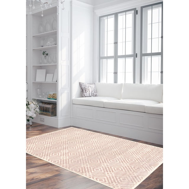 ECARPET Area Rug for Living Room, Geometric Indoor Carpet Ember Collection in a bright living room with white built-in bench seating and a patterned accent pillow, featuring a beige and cream geometric diamond pattern on hardwood floors, suitable for enhancing indoor decor and comfort.
