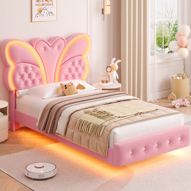 Homfa Twin Size Velvet Upholstered Bed with LED Lights, Floating Platform Bed Frame with Butterfly Crystal Button Tufted Headboard, Pink front-facing twin (76.8in L) view showing a pink velvet butterfly button-tufted headboard with crystal buttons, low floating platform with under-bed LED glow and smooth velvet texture, platform design that removes need for a box spring; often used as a decorative focal in teen or guest bedrooms.