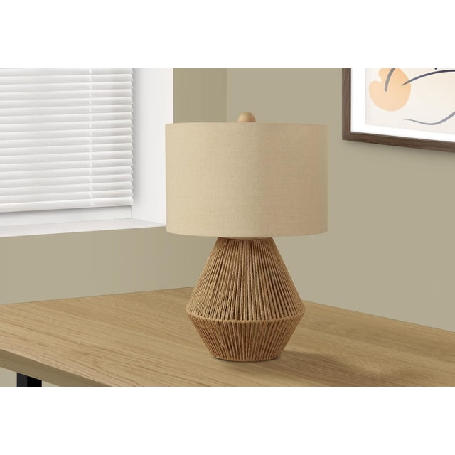 Monarch Specialties Lighting 22"h table lamp with a natural brown linen rope base in a tapered geometric shape, topped with a beige linen drum shade and round wood finial, placed on a light wood table near a window with white blinds and framed abstract art, ideal for living rooms or bedrooms.