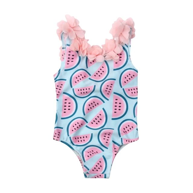 SUNSIOM Baby Girl Swimwear One-piece Floral Ruffle Neck Printed Swimsuit with a playful watermelon print on a light blue background. Features pink 3D flower ruffles along the neckline, a backless design, and breathable polyester material. Ideal for summer vacations, beach outings, and pool parties for babies and toddlers aged 6 months to 4 years.