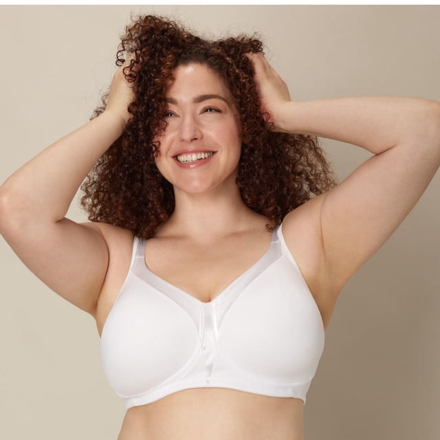 Playtex 18 Hour Sensational Sleek wireless bra in white, front view on a model with hands raised, featuring smooth full coverage cups with satin trim, wide cushioned straps, and a soft underband for wireless support and comfort.