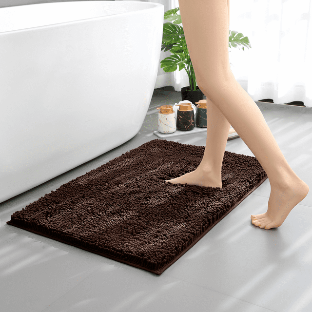 Hitime Soft Chenille Bath Mat Grey 20x30, a plush chenille bathroom runner in brown, displayed near a white bathtub. Features ultra-absorbent microfiber, non-slip TP rubber backing, and quick-drying machine washable design. Perfect for bathroom rug sets and enhancing decor.