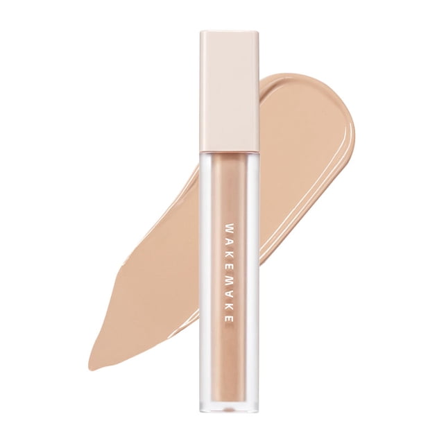 WAKEMAKE Cache-Cernes Couvrant 6 g en 23. Beige Naturel. un tube Élégant de Cache-Cernes Liquide au Ton Beige, Montré à Côté d'Un Échantillon du Produit. Conçu pour Couvrir les Cernes, les Marques d'Acné et les Imperfections pour un Teint Impeccable.