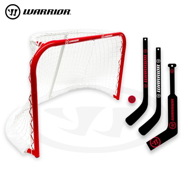 Warrior 31" Mini Pro-Style Hockey Goal Combo Set with a durable red metal 31-inch net and white netting, including two black mini player sticks, one black mini goalie stick, and a red mini hockey ball, suitable for indoor and outdoor mini hockey games and skill practice.
